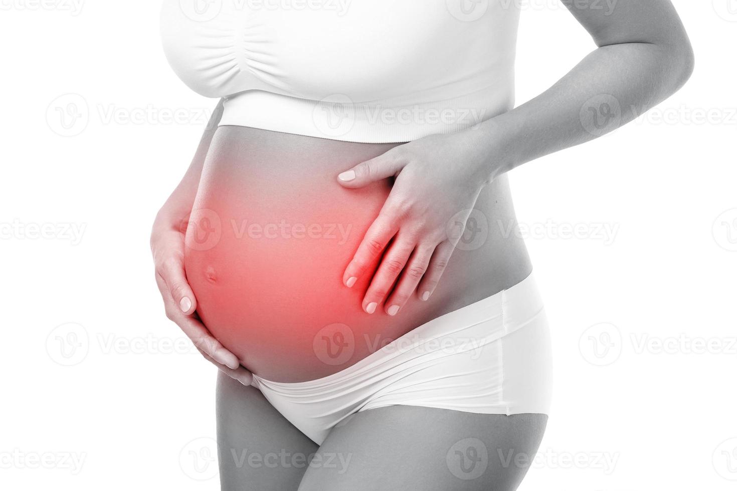 Pregnant woman has pain in her stomach photo