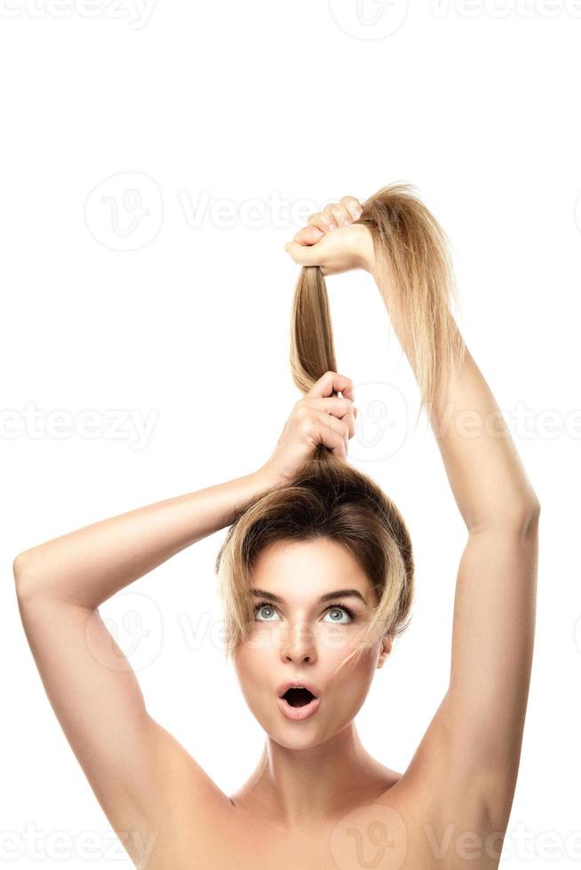 Beautiful woman is very happy of her hair growth progress photo