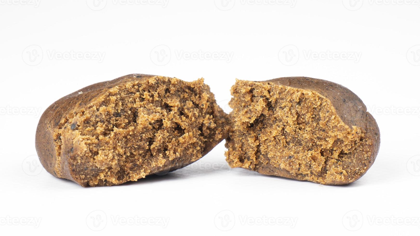 brown broken piece of cannabis concentrate hashish isolated on white background, hash weed photo