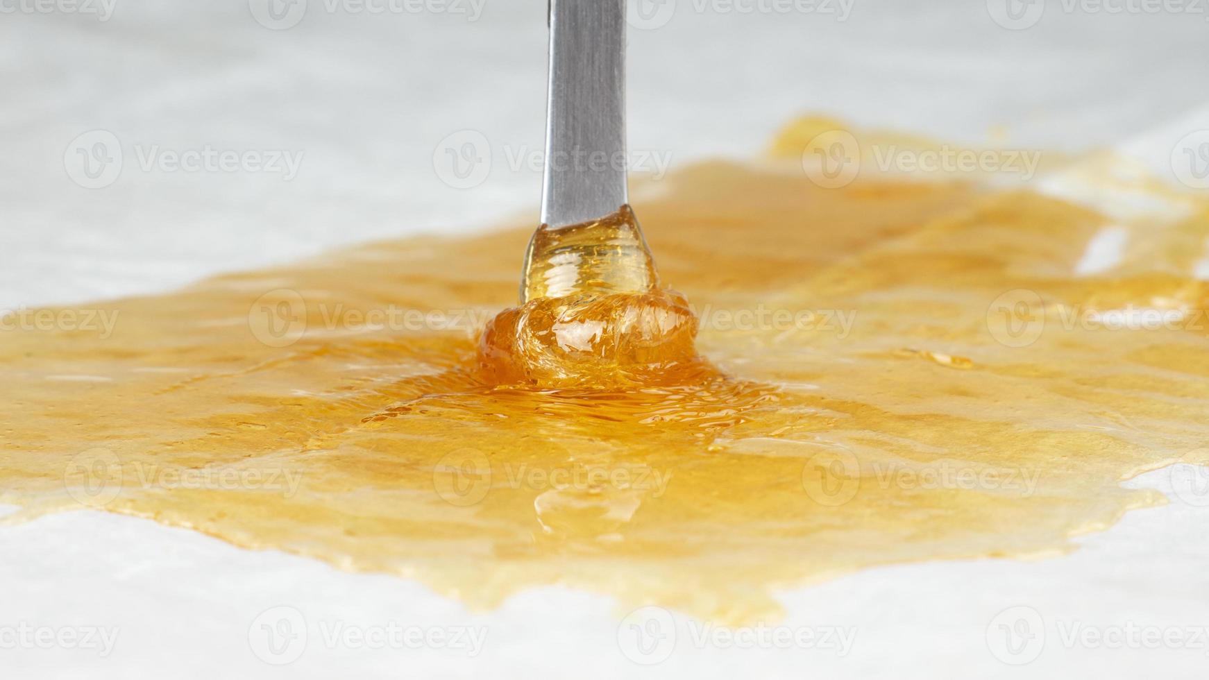 fragrant golden terp sauce for smoking cannabis, wax weed with thc content photo