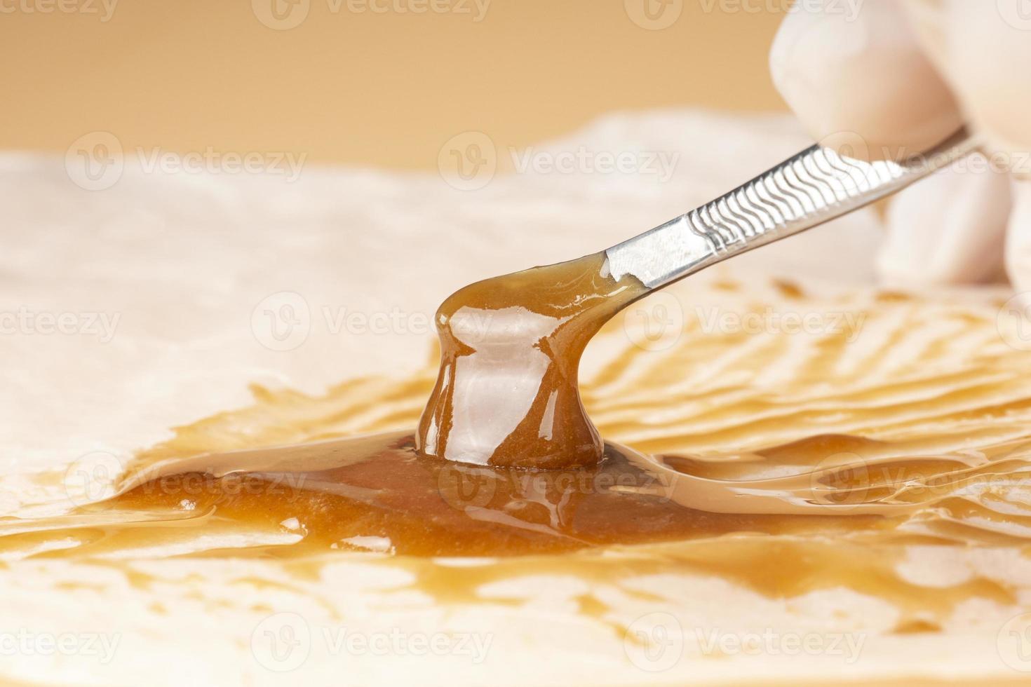 cannabis resin extract for smoking high stone smoke, dab tool and live resin photo