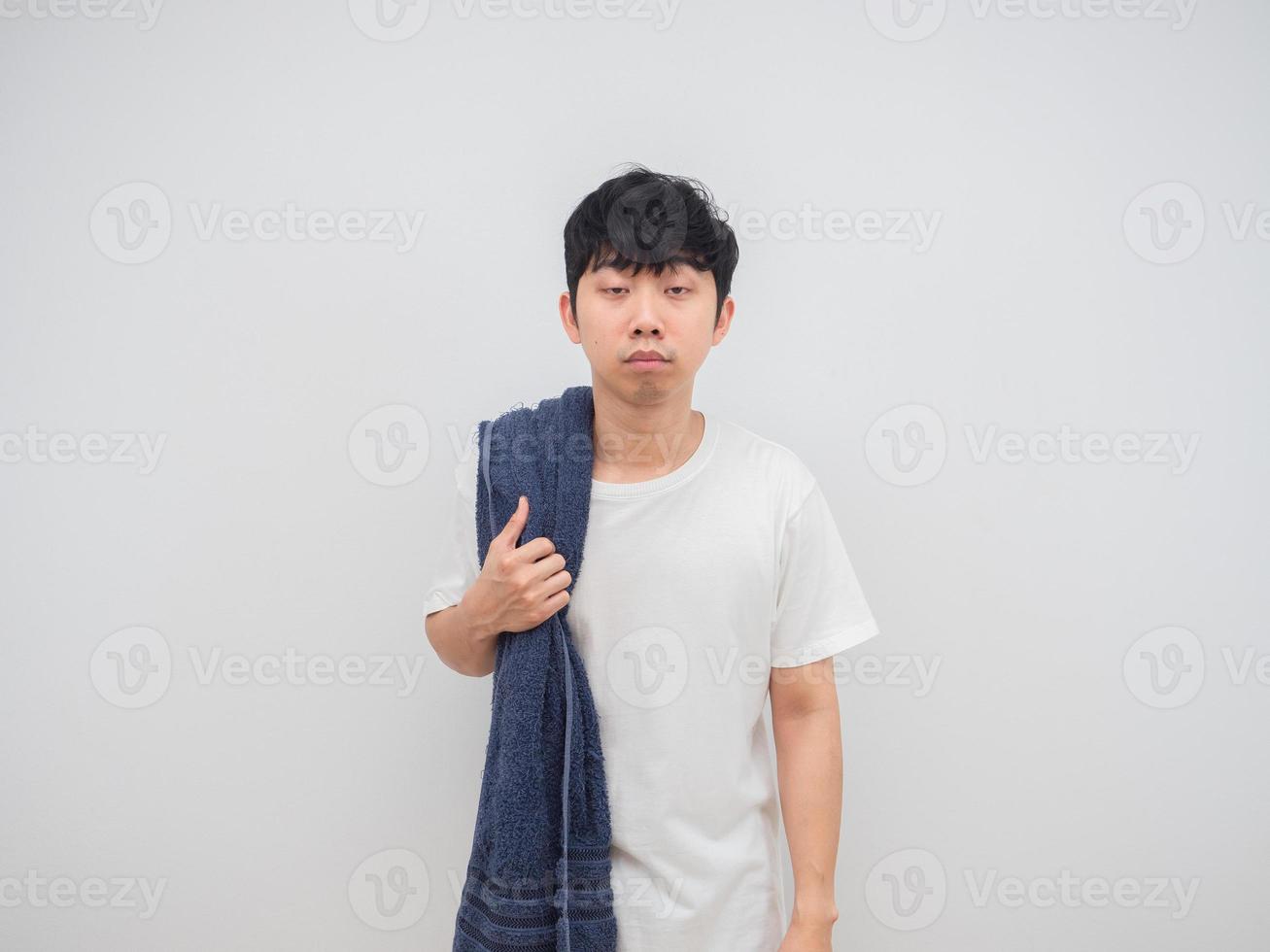 Asian man sleepy with towel wake up at the morning berfore shower feeling lazy concept on white background photo