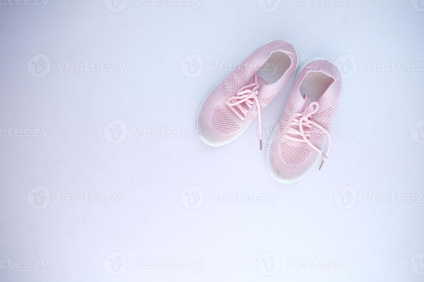 children's shoes on light purple background photo