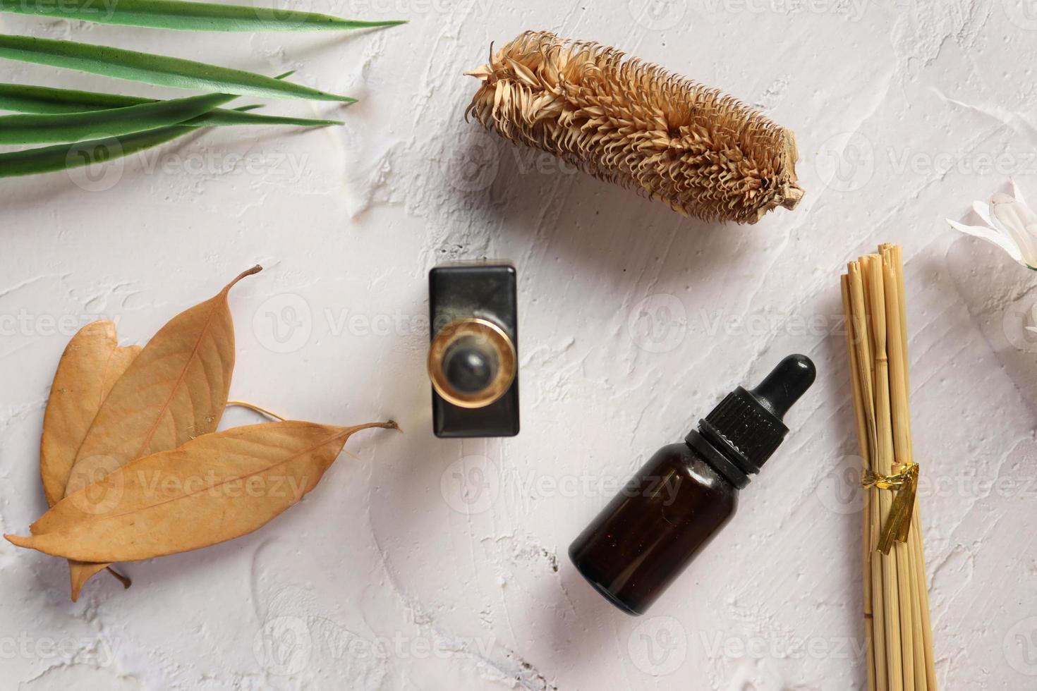 essential citrus oil, dried lemon and spice on table , photo