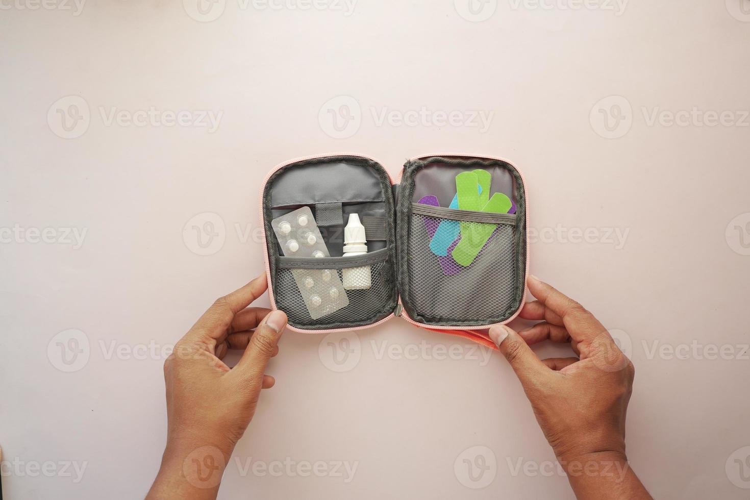 top view of adhesive bandage and a bag on table photo