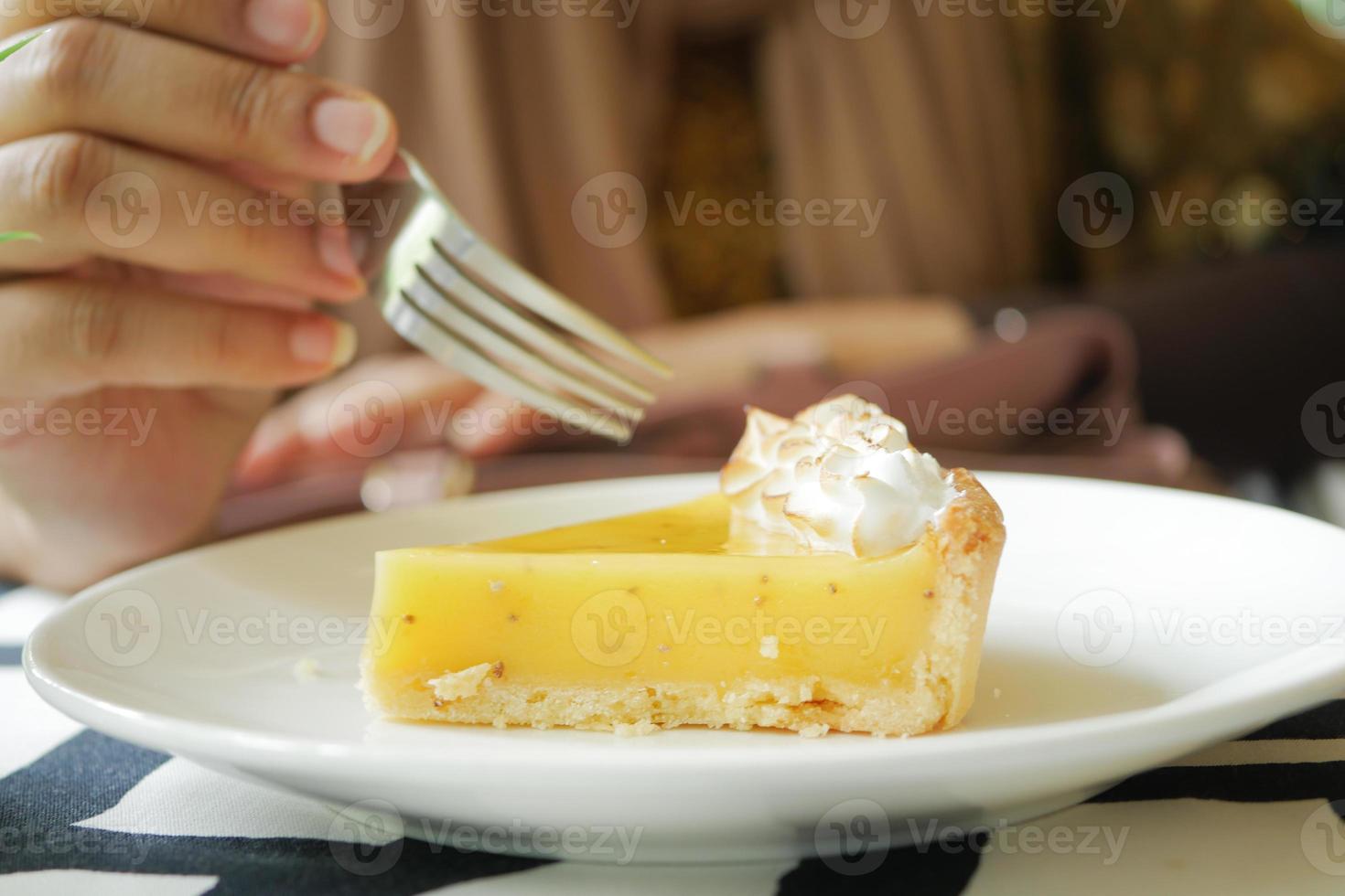 over head view of women eating lemon tart photo