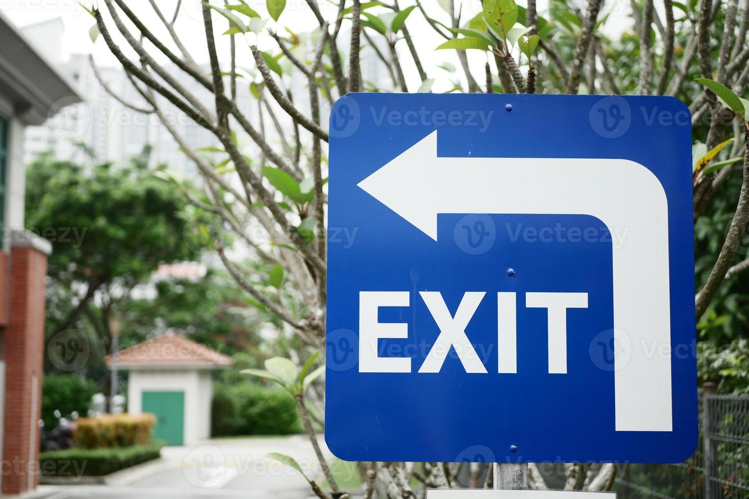 exit sign on brick wall photo