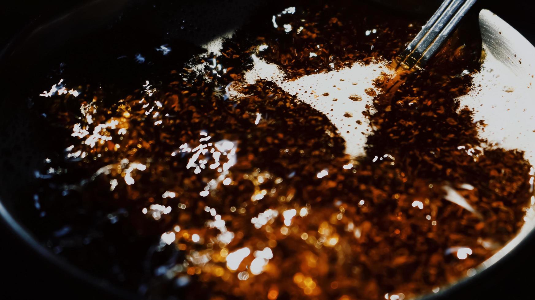 Closeup Of Boiling Tea In A Pot Under Sunlight in Karachi Pakistan 2022 photo