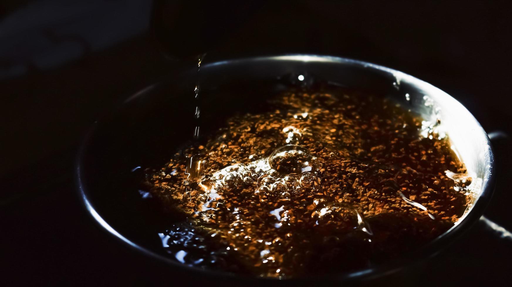 Closeup Of Boiling Tea In A Pot Under Sunlight in Karachi Pakistan 2022 photo