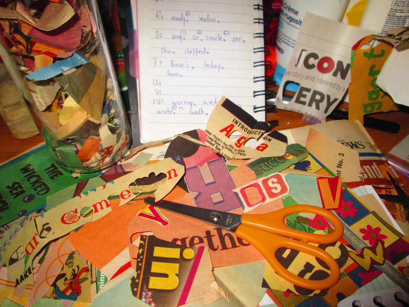 Scrapbooking Supplies and Newspaper Cuttings Scattered On Table In Karachi Pakistan 2022 photo