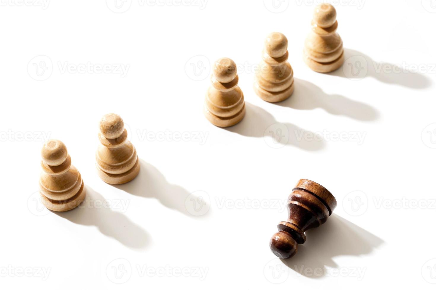 One black chess pawn among whites. Concept of racism and discrimination. photo