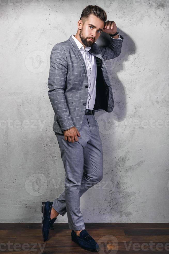 Handsome and bearded man wearing gray suit photo