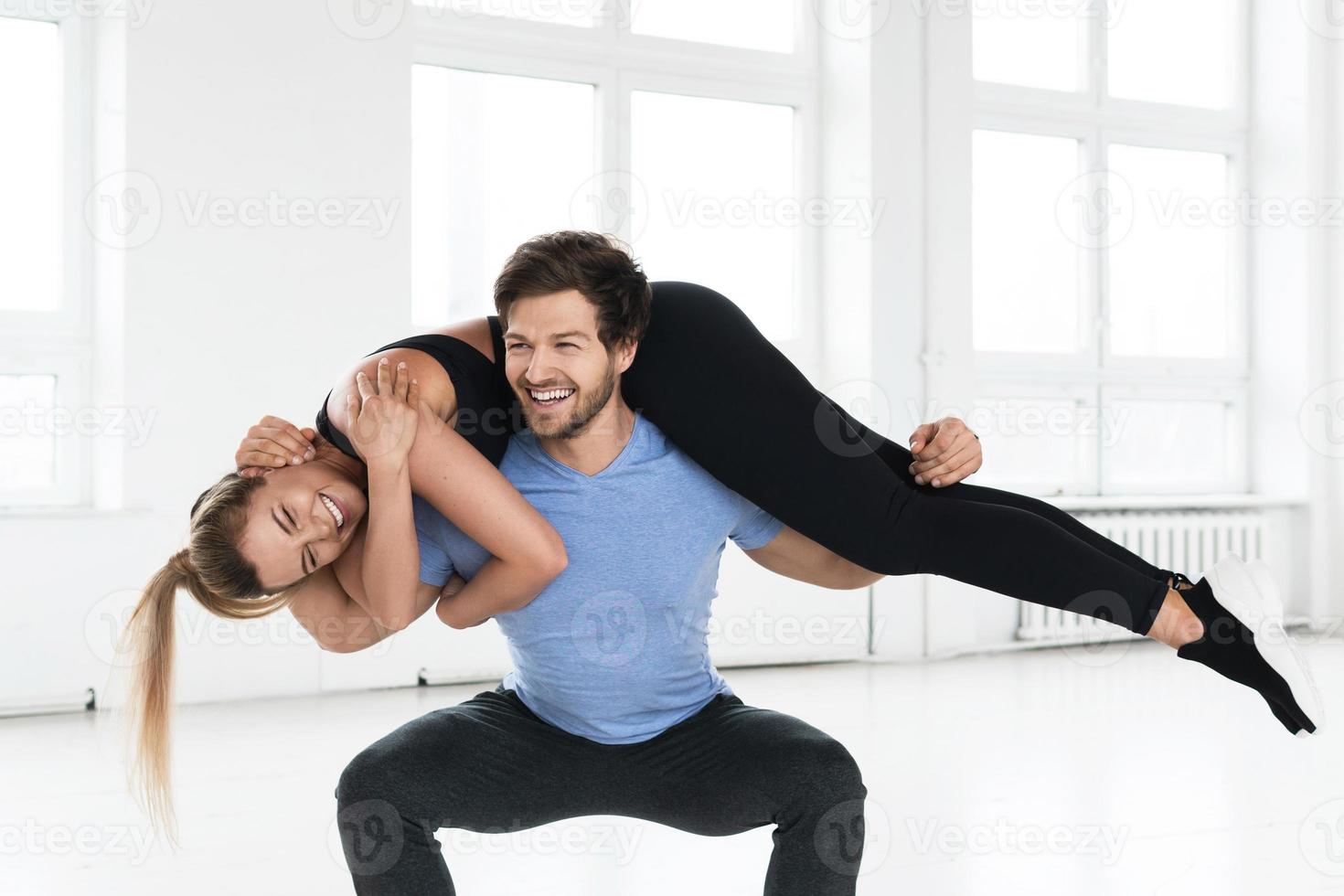 Fitness couple during calisthenics workout in the gym photo