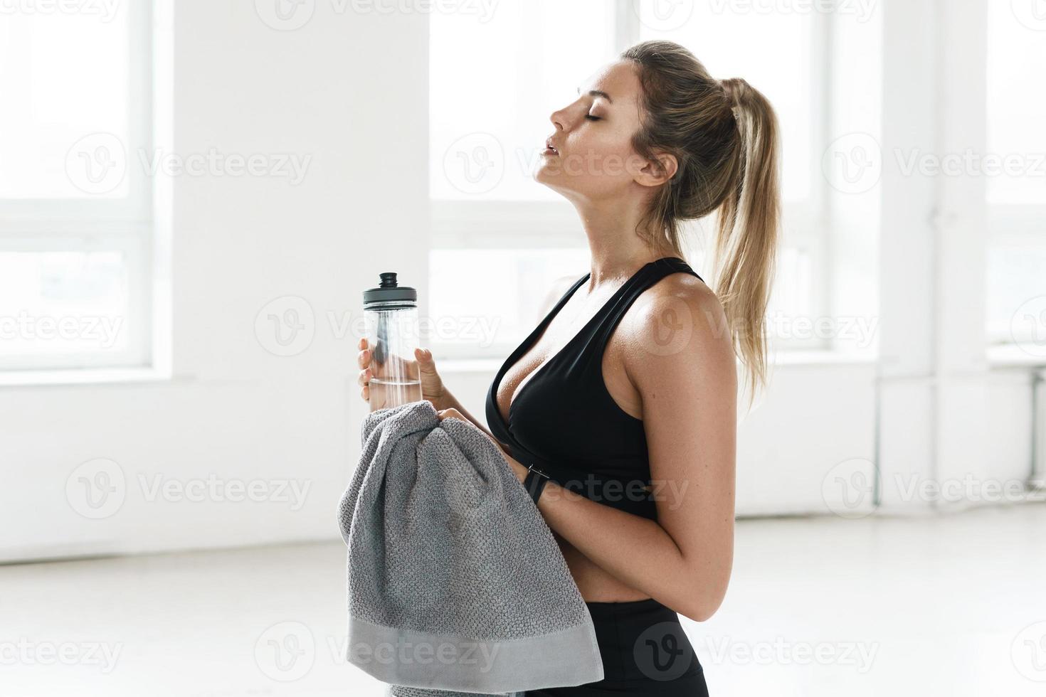 Sweat on woman chest after heavy cardio workout and weight