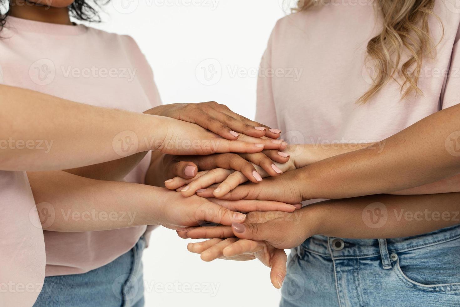 Different ethnicity female hands. Multicultural diversity and friendship. photo