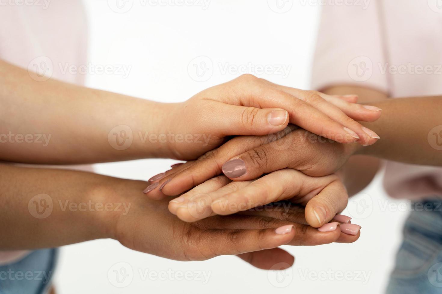 Different ethnicity female hands. Multicultural diversity and friendship. photo