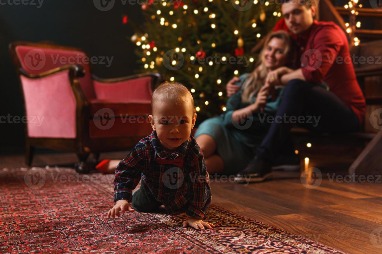 Young happy family are celebrating Christmas or New year. photo