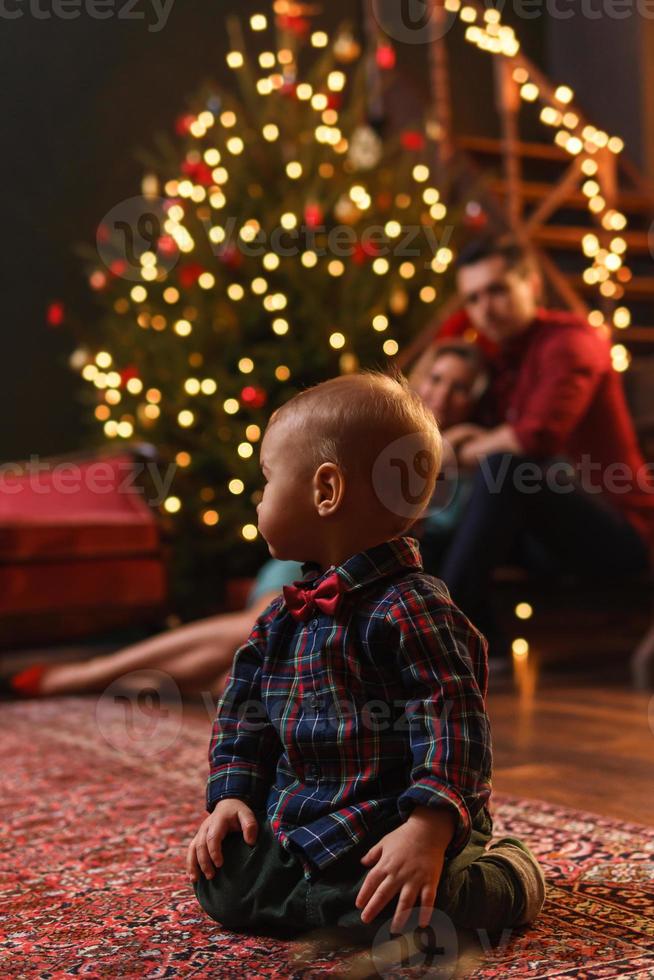 Young happy family are celebrating Christmas or New year. photo