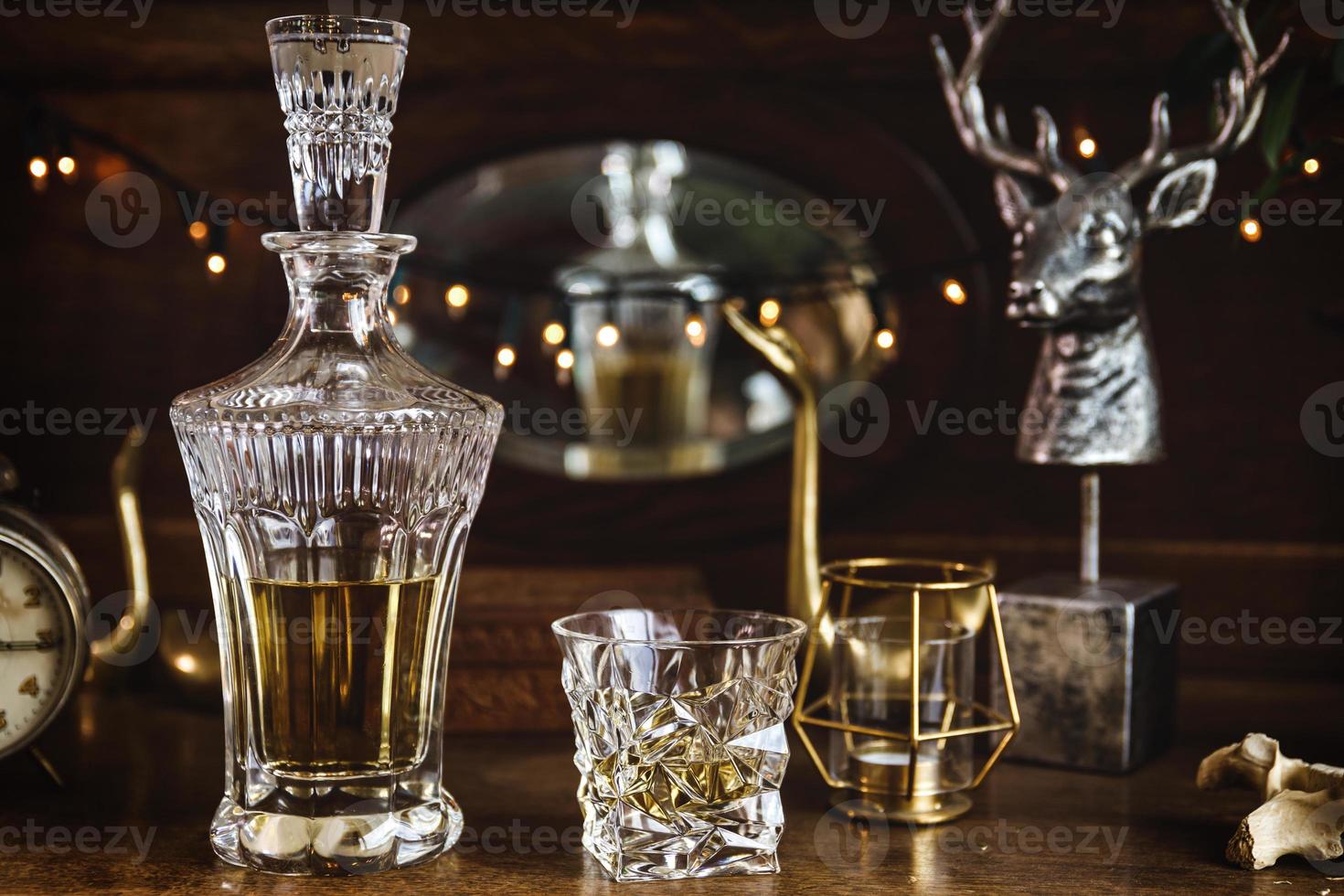 Expensive crystal decanter and glass of whiskey photo