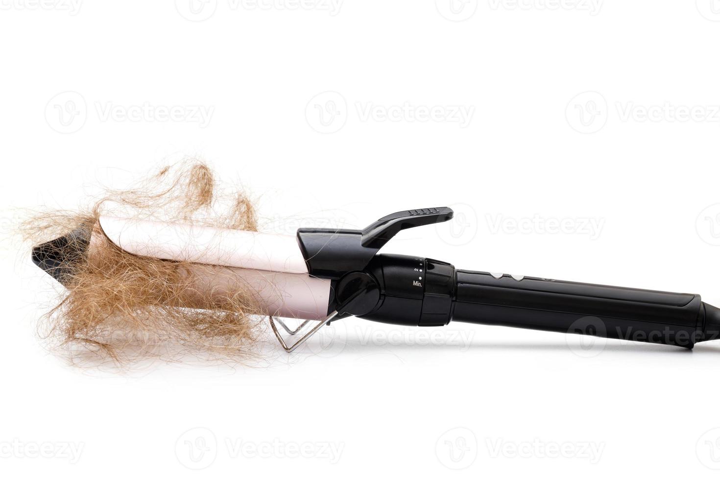 herramienta de rizador de cabello y mechón de cabello foto