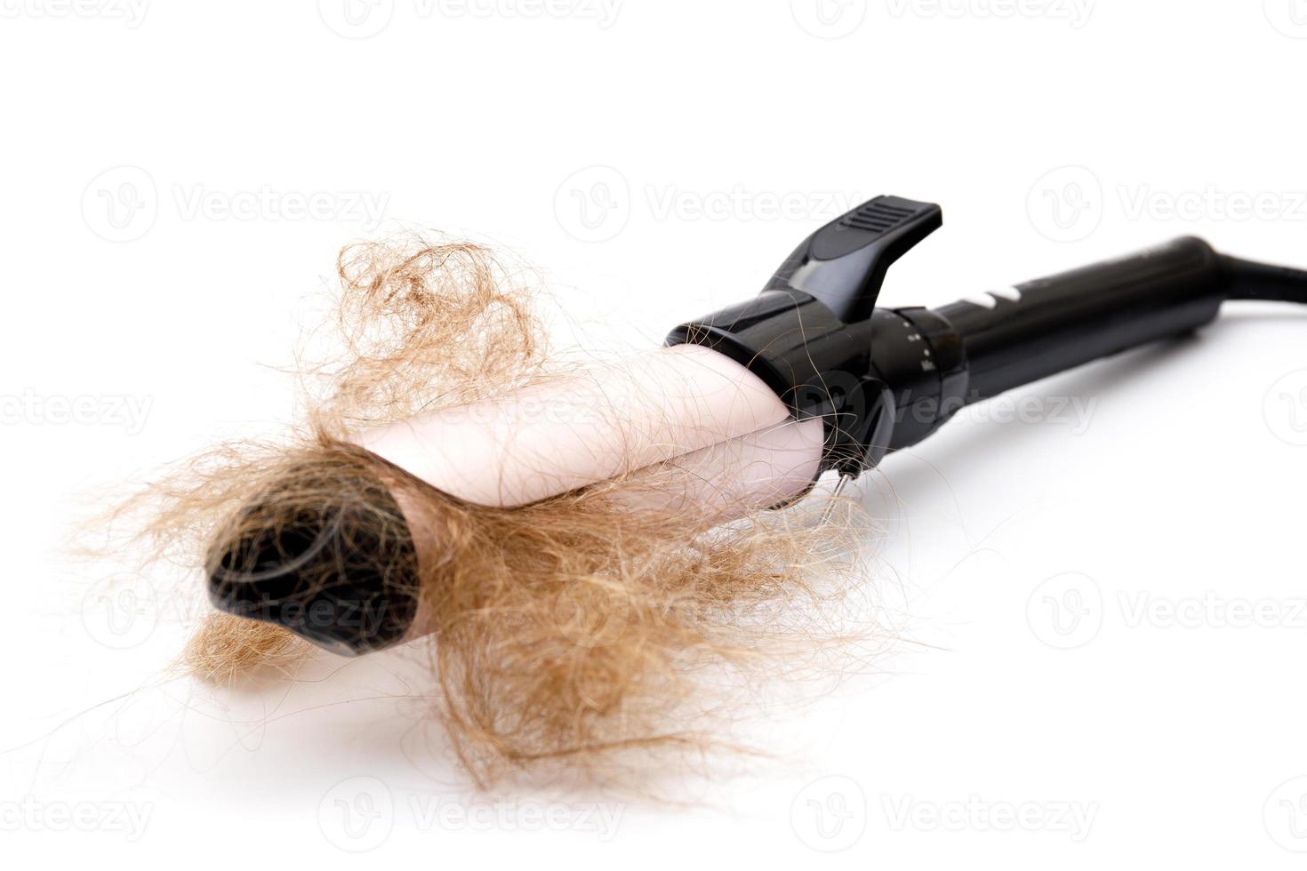 Hair curler tool and clump of hair photo