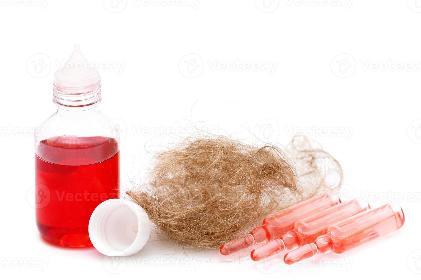 Ampoules with special serum and bottle with oil for hair loss prevention photo