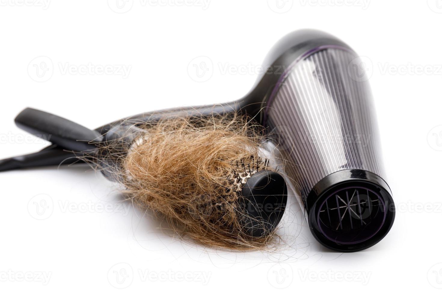 Hair dryer and brush with a lump of hair photo