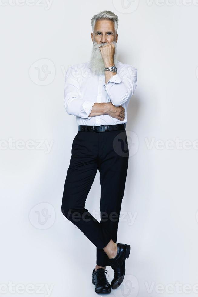 Handsome aged male model posing on white background photo