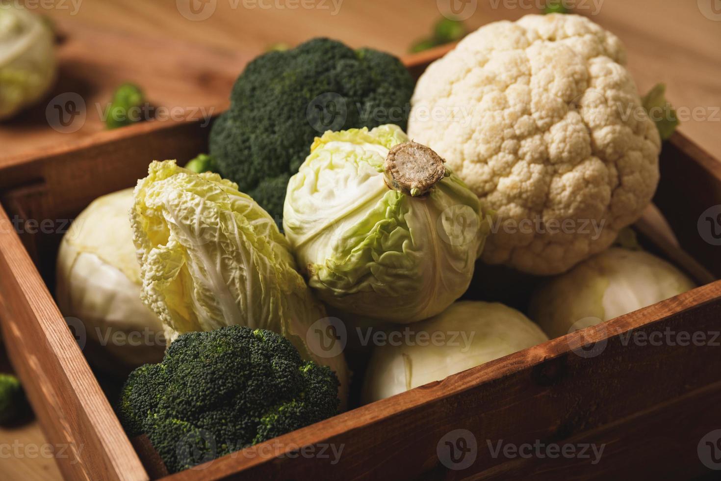 A lot of different cabbages in the wooden box photo