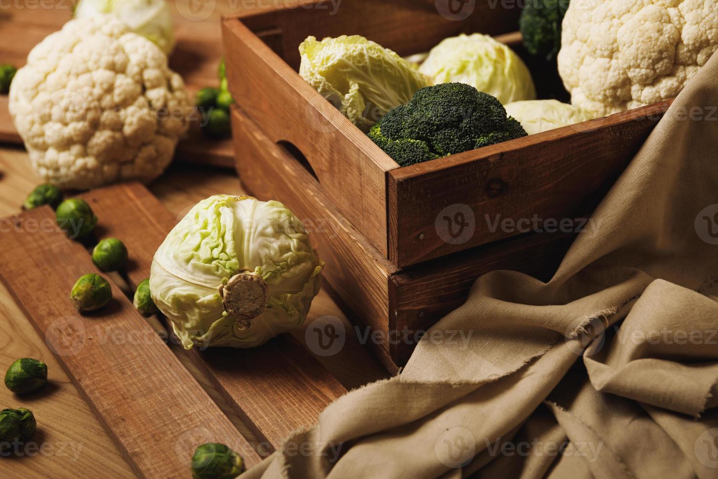 A lot of different cabbages in the wooden box photo