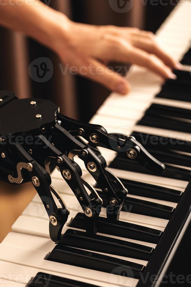 Human with neural hand prosthesis playing piano photo