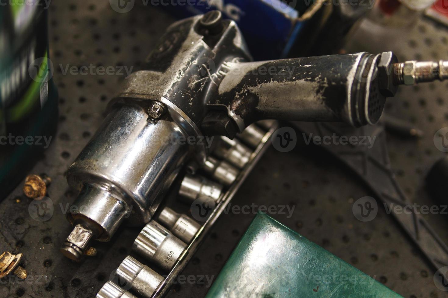 Impact wrench in the automobile repair shop photo