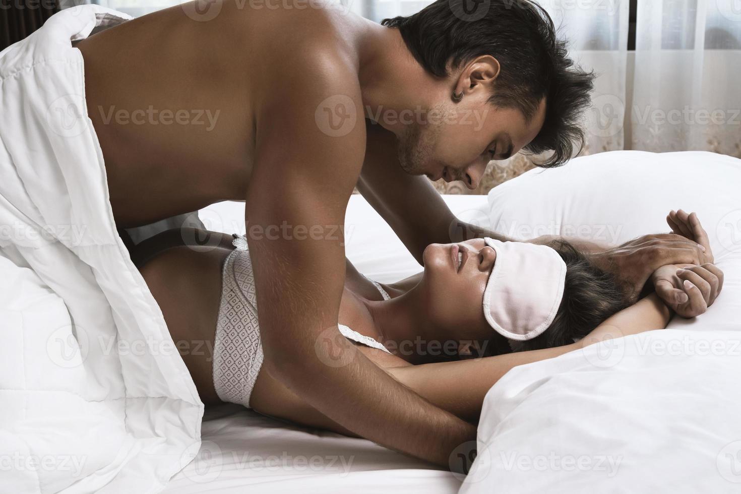 Beautiful couple making love in the bed photo