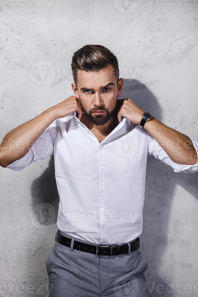 Portrait of handsome bearded man wearing white shirt photo