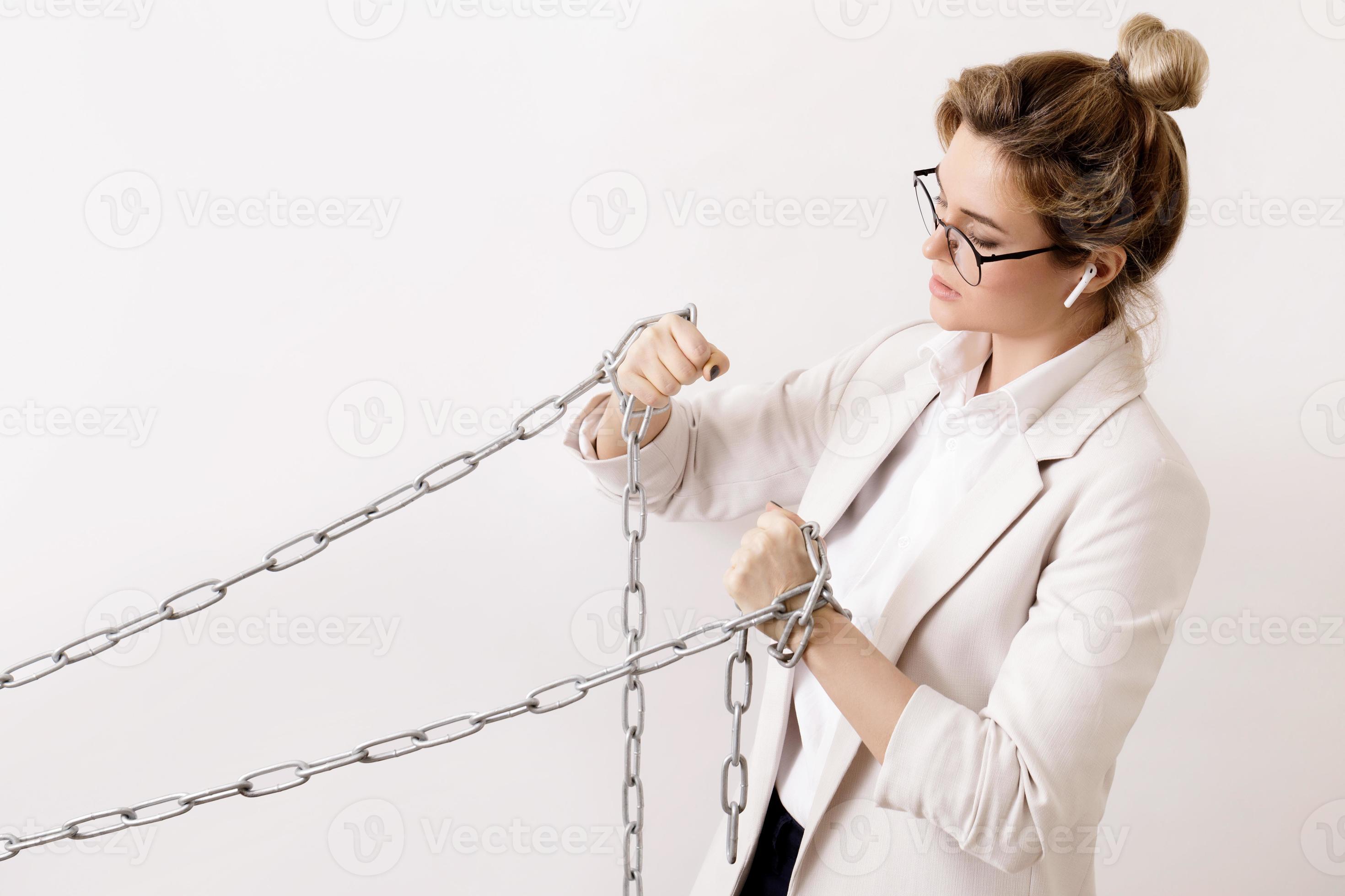 Tired business woman is pulling the chains 16251757 Stock Photo at Vecteezy