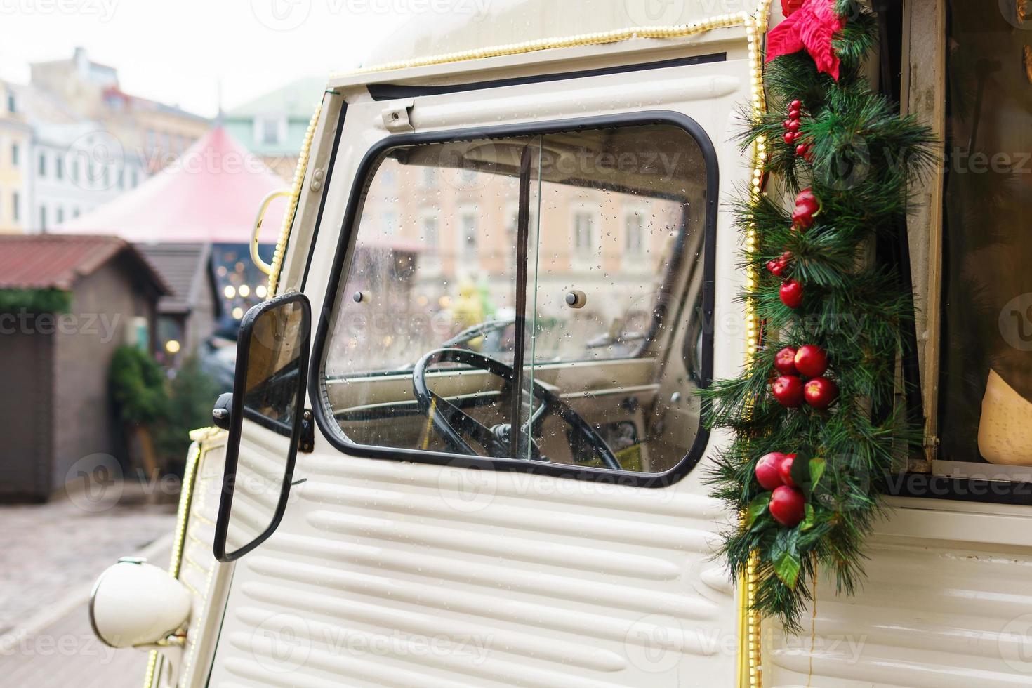 Retro van outside with beautiful Christmas decorations photo