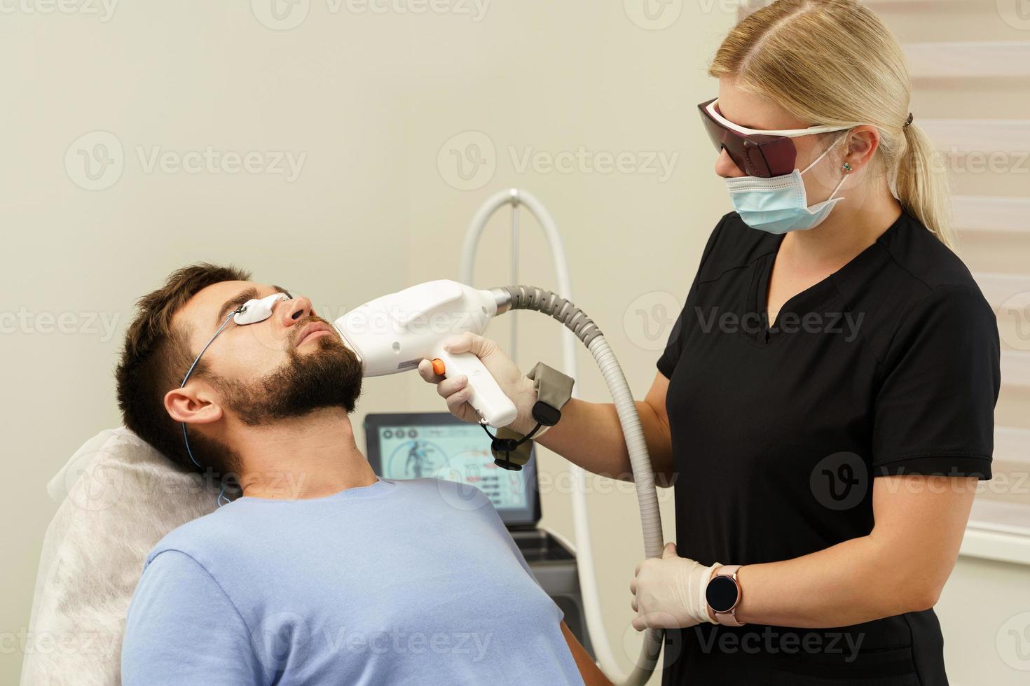 Man during beard photoepilation procedure photo