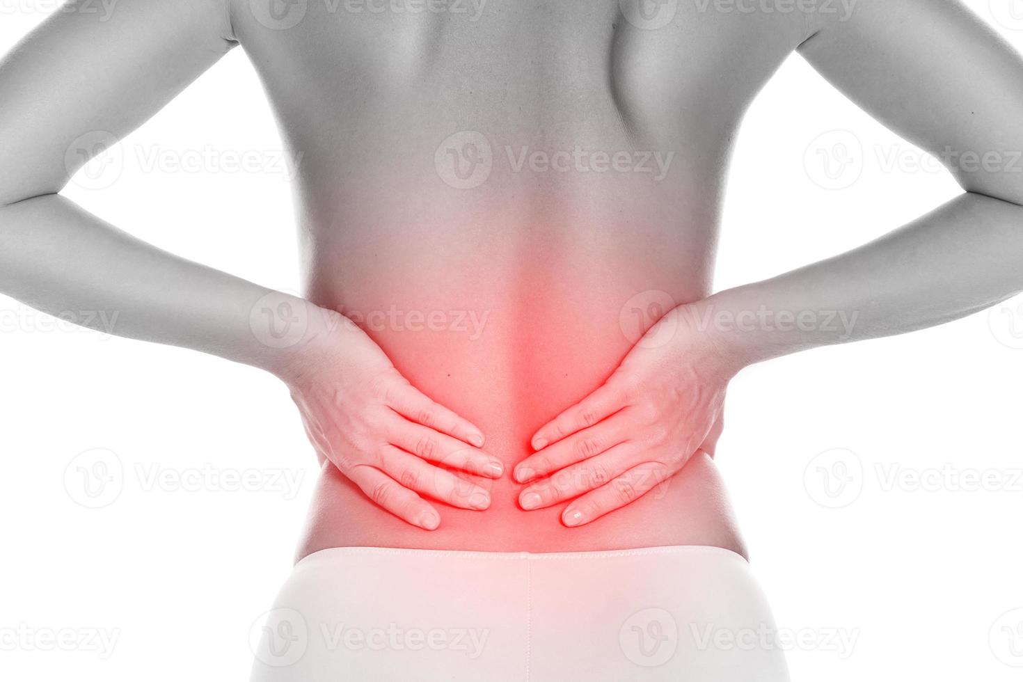 Young woman suffering from lower back pain photo