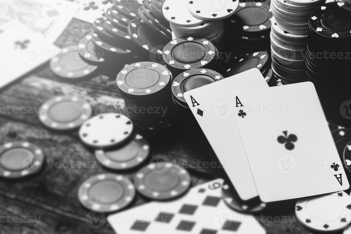 Monochrome image of two aces and a lot of casino chips photo