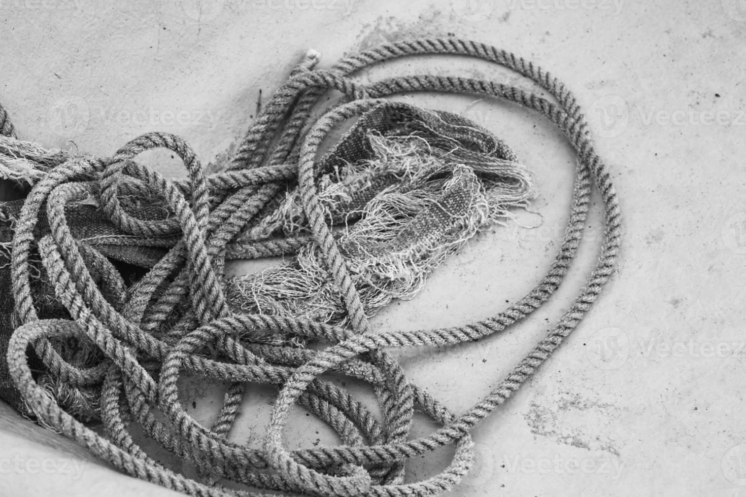 Closeup of coil of nautical rope on fishing boat hull. photo