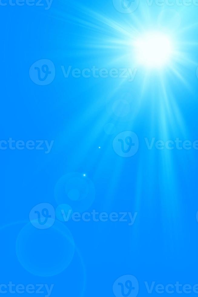 Bright sun on blue sky.Bright midday sun on the blue sky. Sun shining in the blue sky. photo