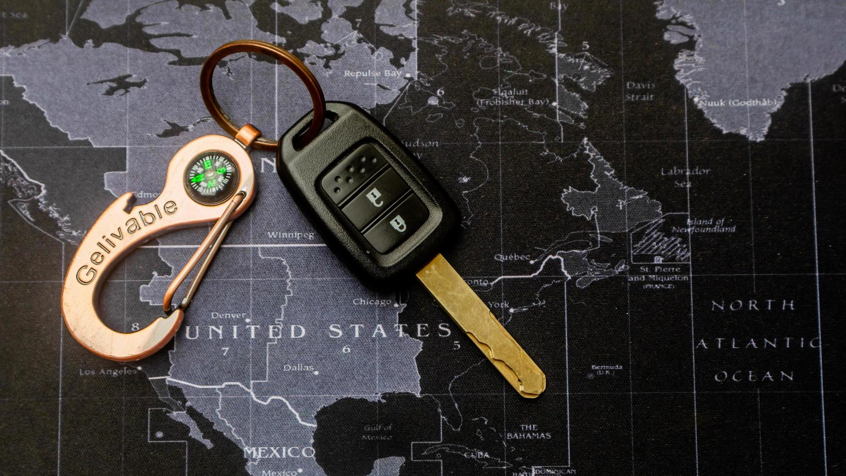 black car keys on black map photo