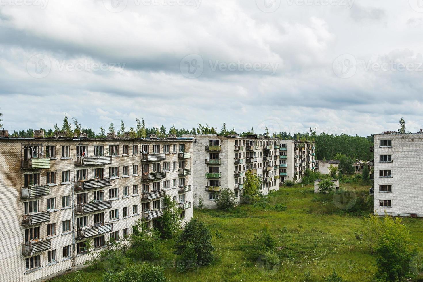 Exterior of abandoned apartment buildings in european ghost town. photo