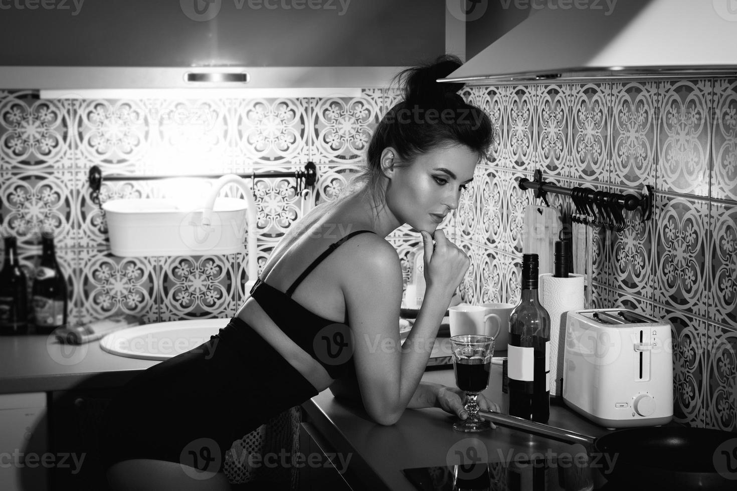 Portrait of gorgeous woman wearing lingerie in the kitchen photo