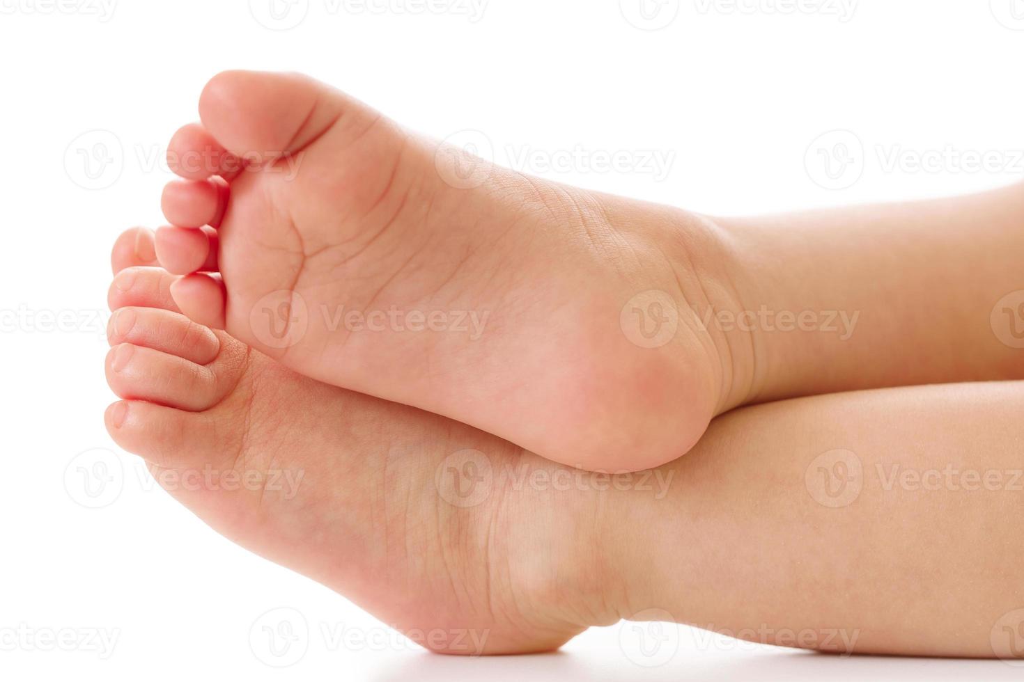 Closeup shot of little child feet and soles. photo