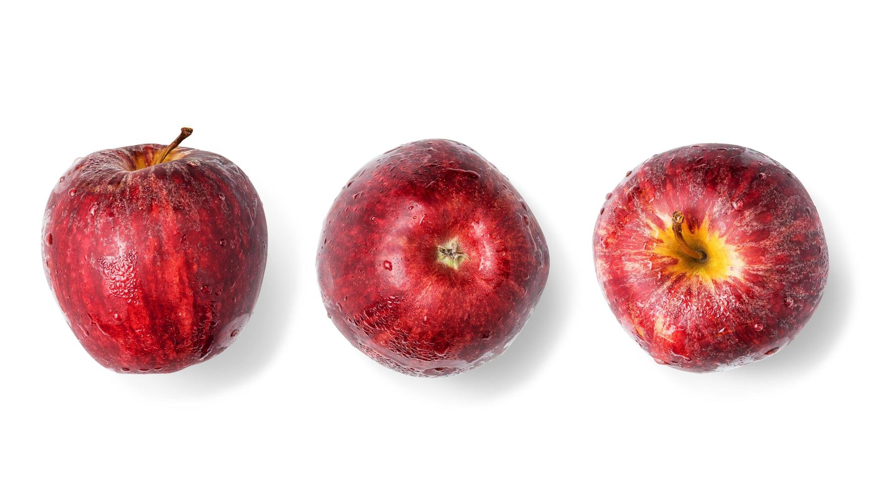 Red apples with dew and water droplets on a white background. photo