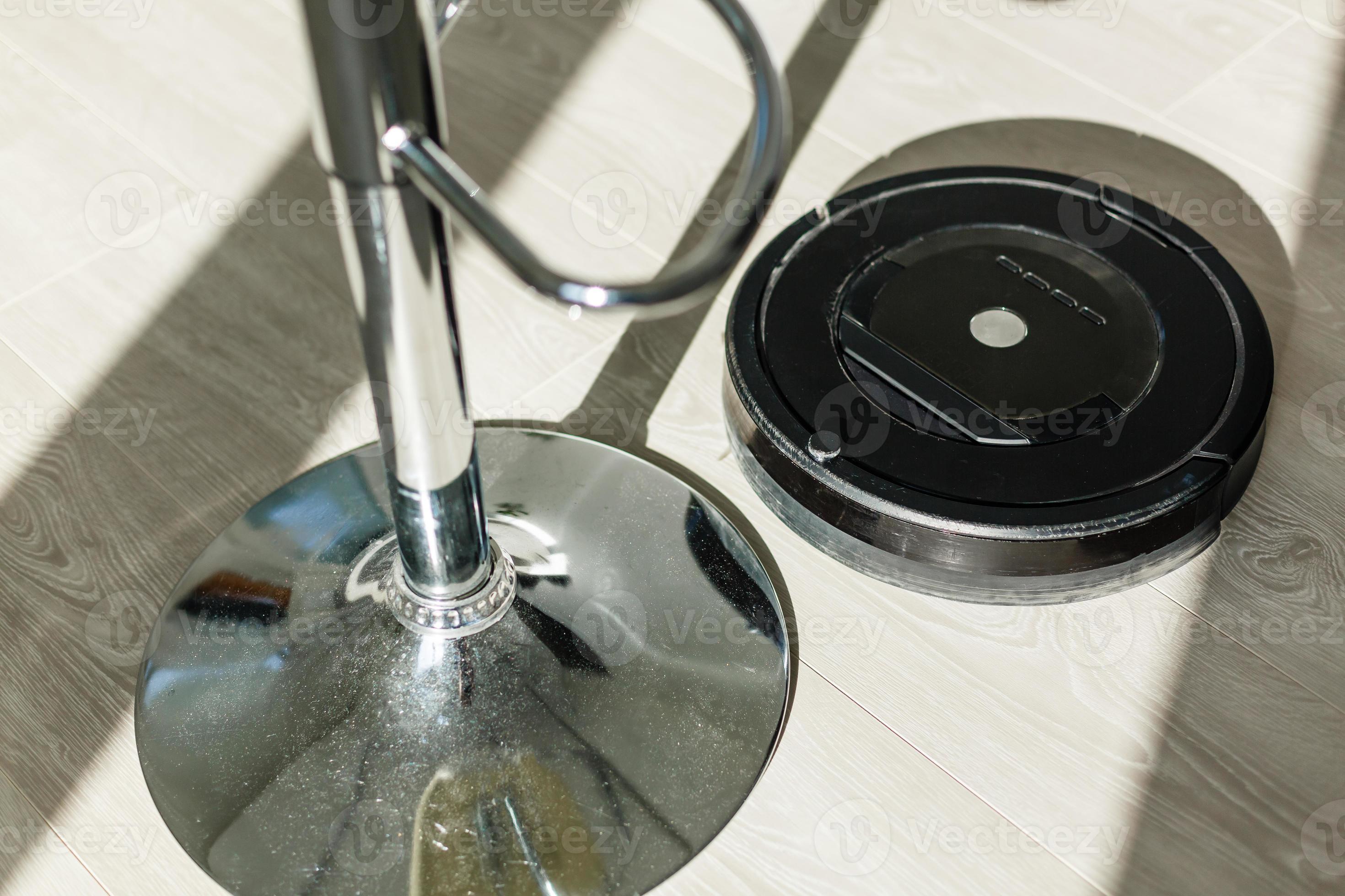 Robotic vacuum cleaner on laminate wood floor smart cleaning technology