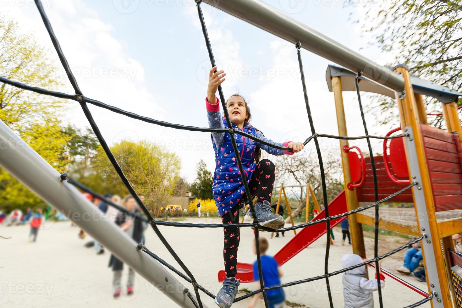 Active little girl on playground photo