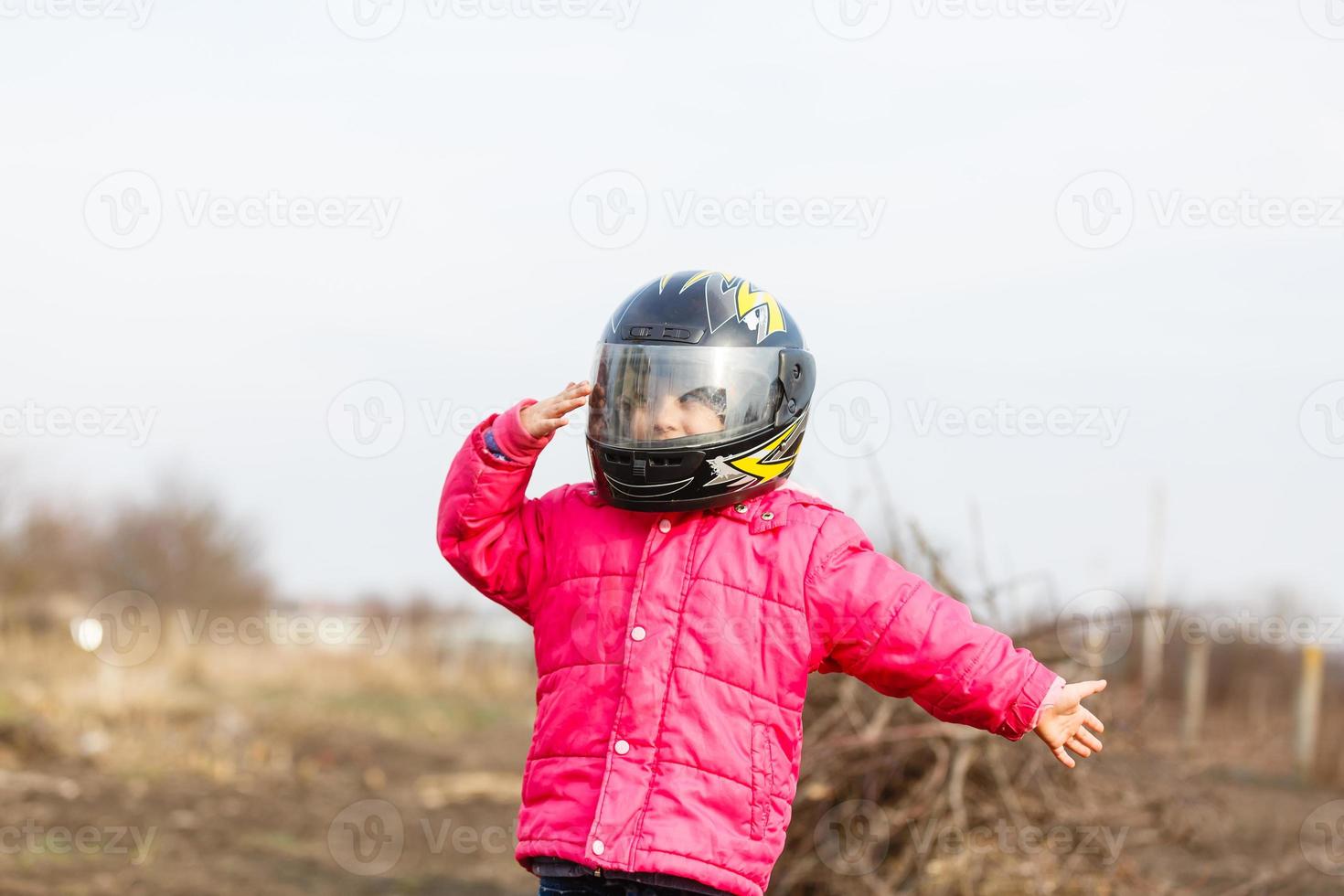 Little girl in a motorcycle helmet. photo