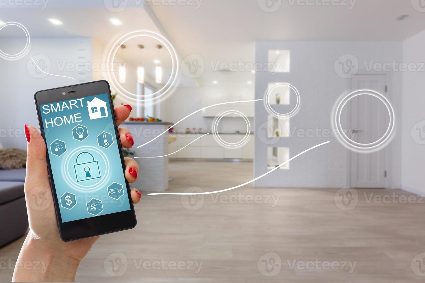 Smart home technology interface on smartphone app screen with augmented reality view of internet of things  connected objects in the apartment interior, person holding device photo